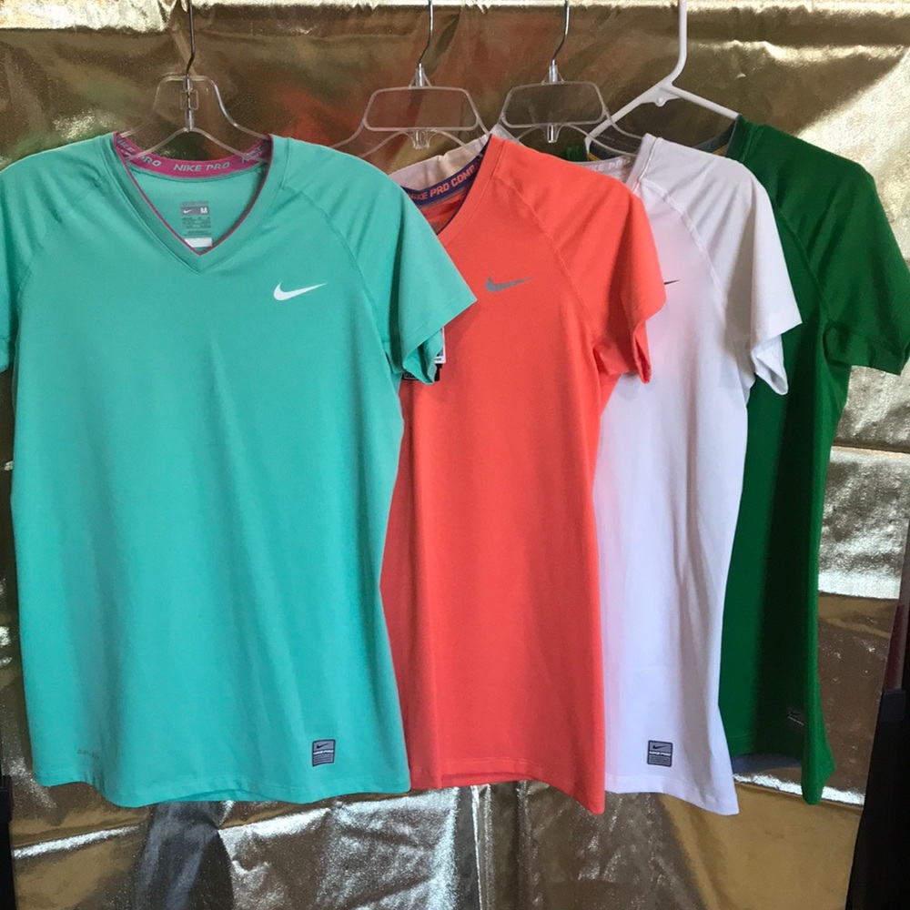 4 Nike Pro Dri Fit work out shirts. Slim fit.